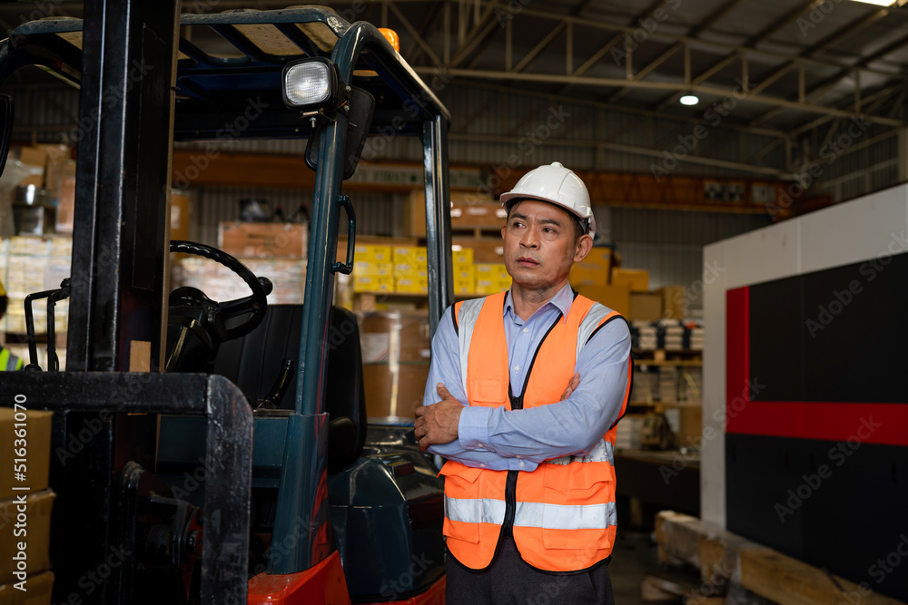 Portrait of male supervisor standing in warehouse with looking at camera. Portrait of male supervisor standing in warehouse with looking at camera.