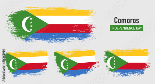 Textured collection national flag of Comoros on painted brush stroke effect with white background
