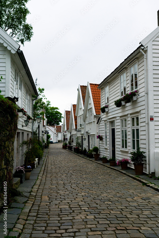 Norwegian street with typical Scandinavian houses in white in Gamle Stavanger