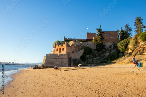 Medieval Castle of Arade on the sunny beach in the civil parish of Ferragudo, Portugal photo