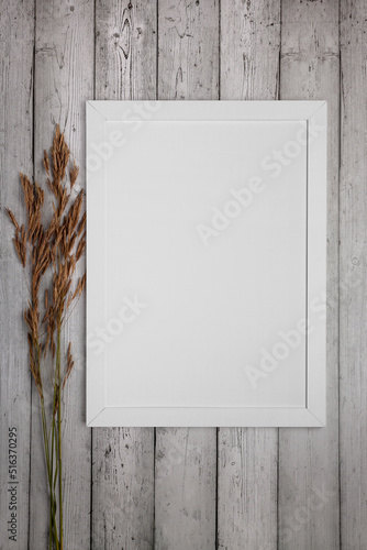 Mockup frame for text or picture on gray wooden background.