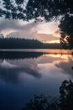 Serene view of a lake during sundown captured using long exposure with perfect reflection