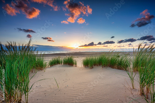 Beautiful sunset on the beach of the Sobieszewo Island at the Baltic Sea. Poland