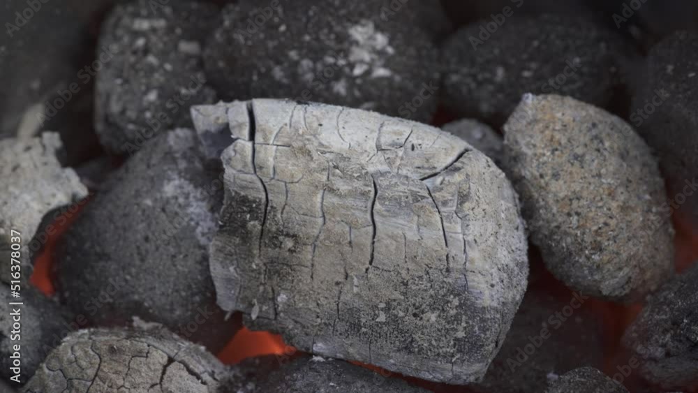 Charcoal briquettes ashing over while preheating for barbecue Charcoal briquettes ashing over while preheating for barbecue