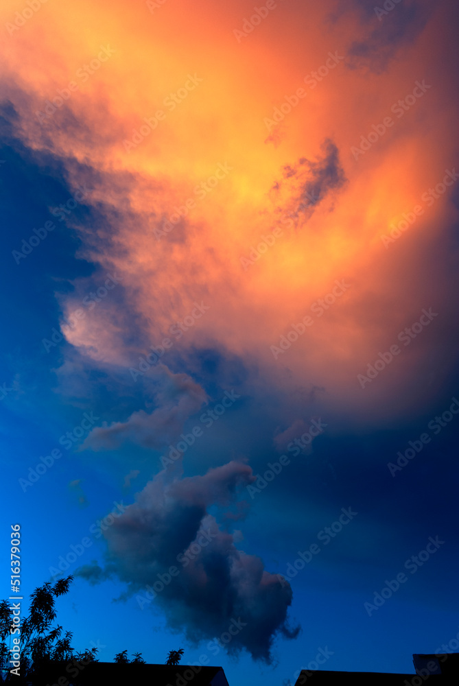 Naklejka premium Clouds in the open sky dramatic sunset in latin america, natural space to meditate and live the universe in a relaxed evening.