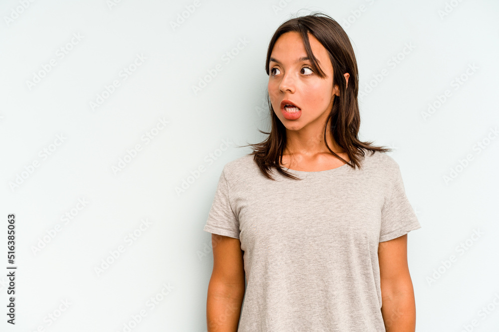 Young hispanic woman isolated on blue background raising both thumbs up, smiling and confident. Young hispanic woman isolated on blue background raising both thumbs up, smiling and confident.