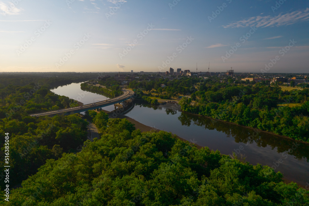 Aerial shot of a river with a distant bridge