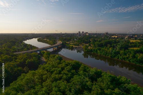 Aerial shot of a river with a distant bridge