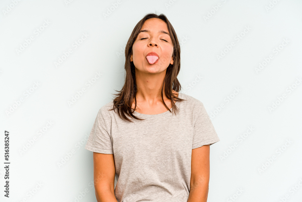 Young hispanic woman isolated on blue background with fingers on lips keeping a secret. Young hispanic woman isolated on blue background with fingers on lips keeping a secret.