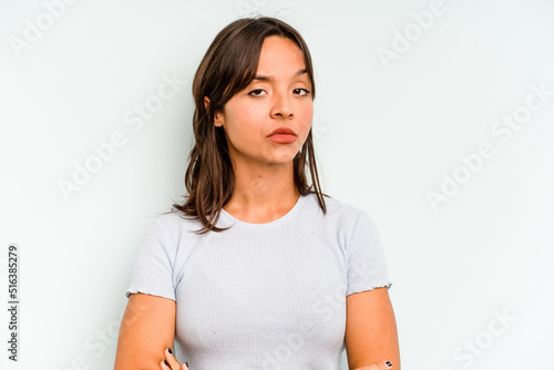 Young hispanic woman isolated on blue background touching temples and having headache.