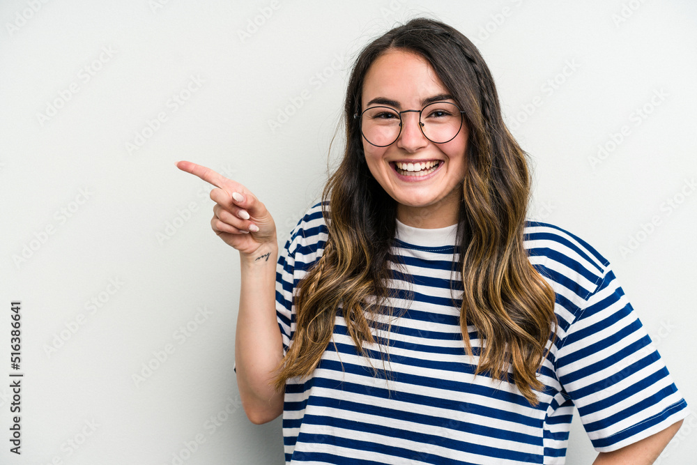 Young caucasian woman isolated on white background smiling cheerfully pointing with forefinger away. Young caucasian woman isolated on white background smiling cheerfully pointing with forefinger away.