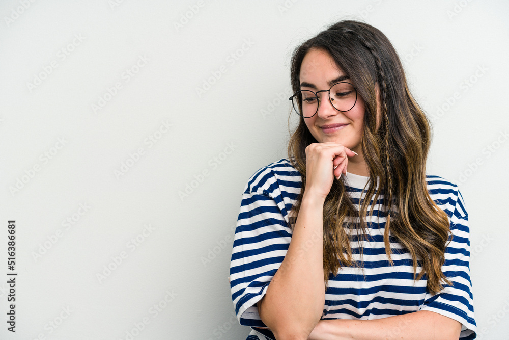 Young caucasian woman isolated on white background looking sideways with doubtful and skeptical expression. Young caucasian woman isolated on white background looking sideways with doubtful and skeptical expression.