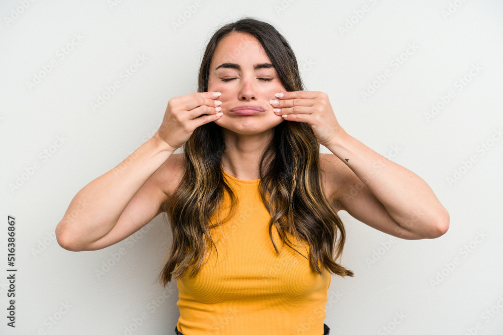 Young caucasian woman isolated on white background doubting between two options. Young caucasian woman isolated on white background doubting between two options.