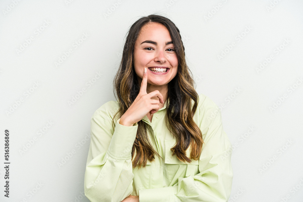 Young caucasian woman isolated on white background smiling happy and confident, touching chin with hand. Young caucasian woman isolated on white background smiling happy and confident, touching chin with hand.
