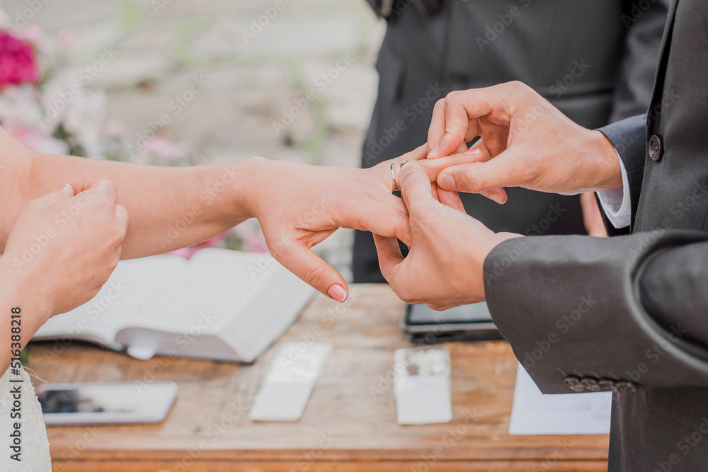 Hands of bride and groom at Happy wedding ceremony to exchange of wedding rings Hands of bride and groom at Happy wedding ceremony to exchange of wedding rings