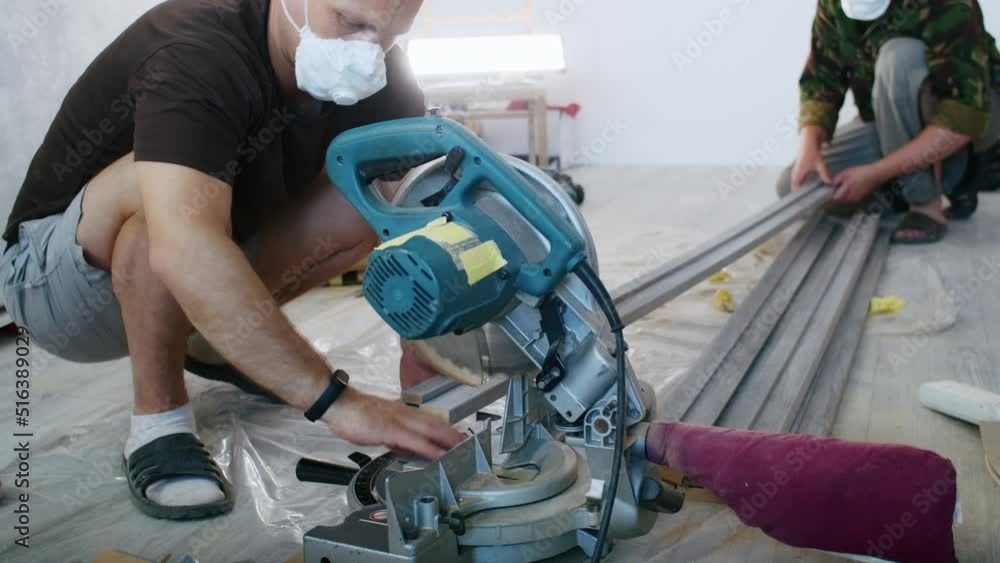 a professional male master is installing doors in an apartment. a professional male master is installing doors in an apartment.