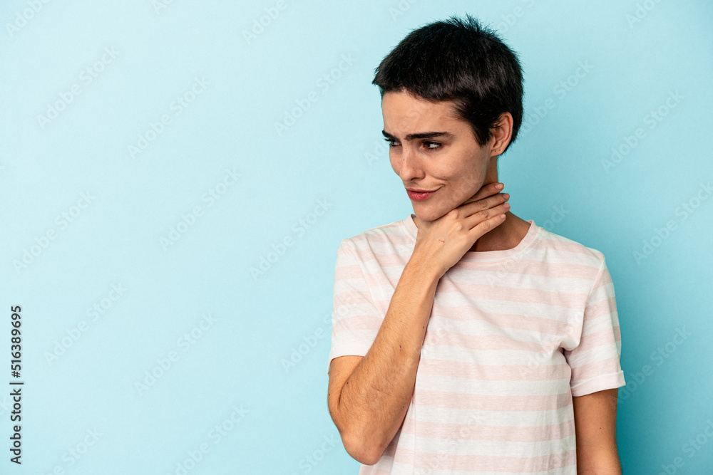 Young caucasian woman isolated on blue background touching back of head, thinking and making a choice. Young caucasian woman isolated on blue background touching back of head, thinking and making a choice.