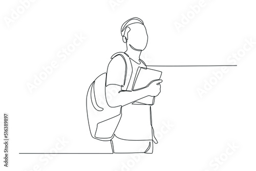 One continuous line drawing of boy student standing with backpack on his back and hold book in his hand. Back to school concept. Single line draw design vector graphic illustration.