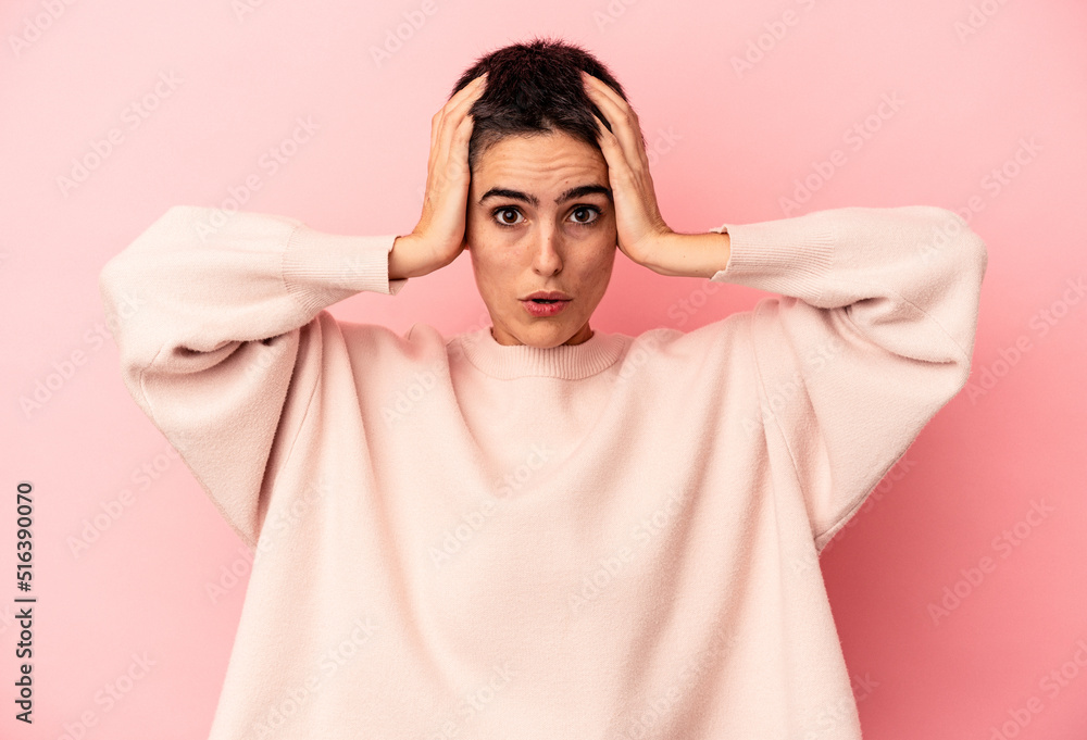 Young caucasian woman isolated on blue background being shocked, she has remembered important meeting. Young caucasian woman isolated on blue background being shocked, she has remembered important meeting.