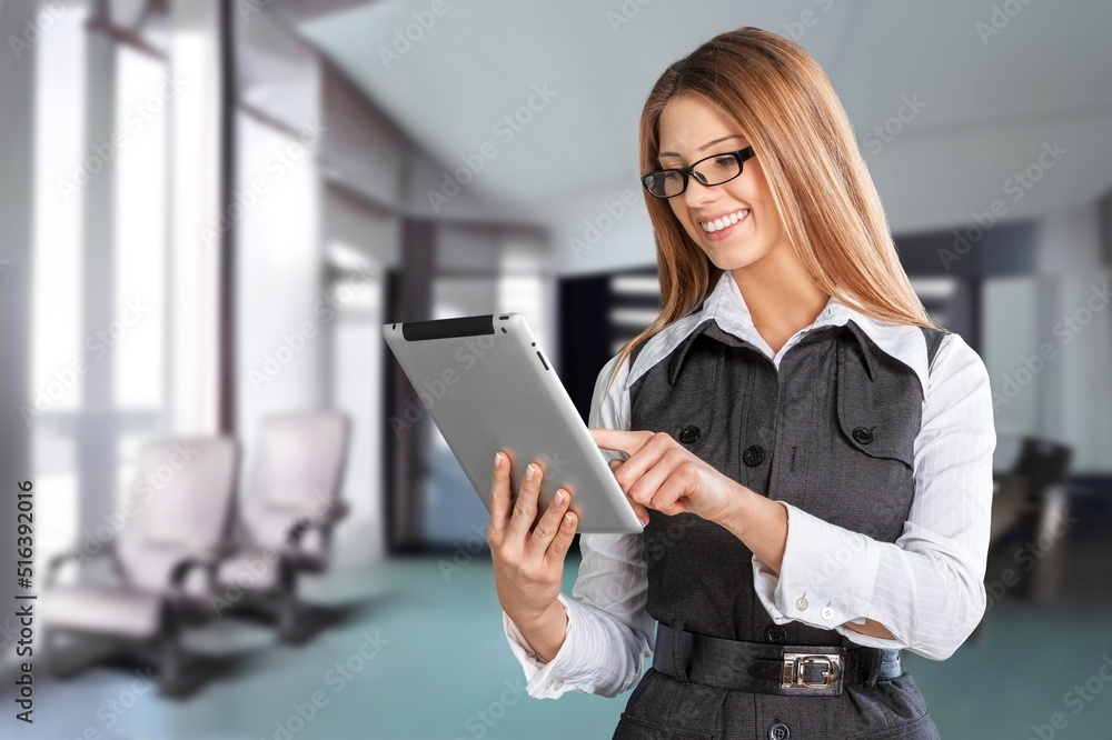 Confident stylish european business woman standing at workplace. Confident stylish european business woman standing at workplace.
