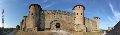 Panoramic view of the old city walls of Carcassonne with a gate and the towers of la Marquière and Samson, Aude department in France photo
