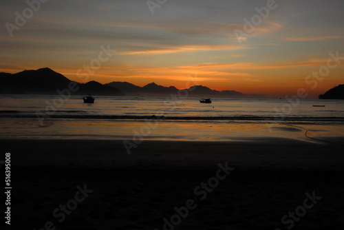 Golden winter sunrise at Itagua beach, Ubatuba, Brazil