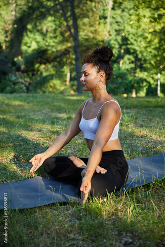 Young woman practicing the warrior yoga pose