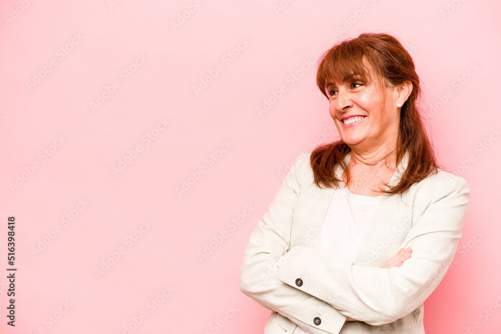 Middle age caucasian woman isolated on pink background smiling confident with crossed arms. Middle age caucasian woman isolated on pink background smiling confident with crossed arms.