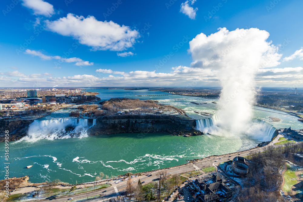 Overlooking the Niagara Falls ( American Falls and Horseshoe Falls ) in a sunny day. Overlooking the Niagara Falls ( American Falls and Horseshoe Falls ) in a sunny day.