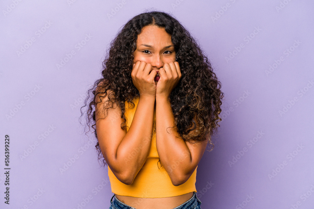 Young hispanic woman isolated on purple background biting fingernails, nervous and very anxious. Young hispanic woman isolated on purple background biting fingernails, nervous and very anxious.