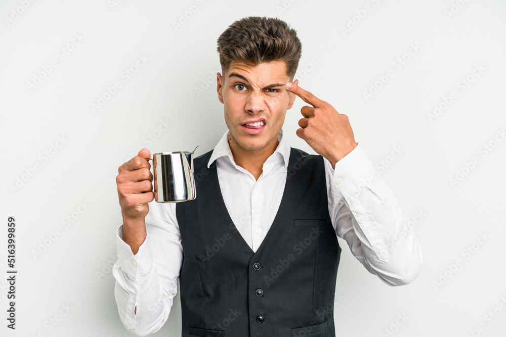 Young caucasian barista man isolated on yellow background showing a disappointment gesture with forefinger. Young caucasian barista man isolated on yellow background showing a disappointment gesture with forefinger.