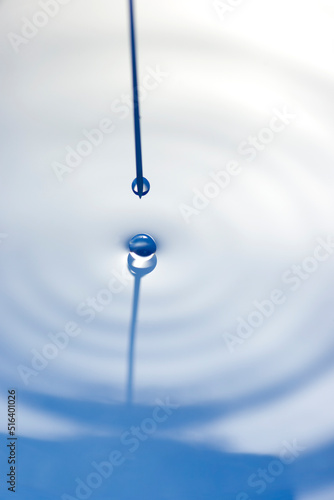 Macro image of a syringe needle with droplet. photo