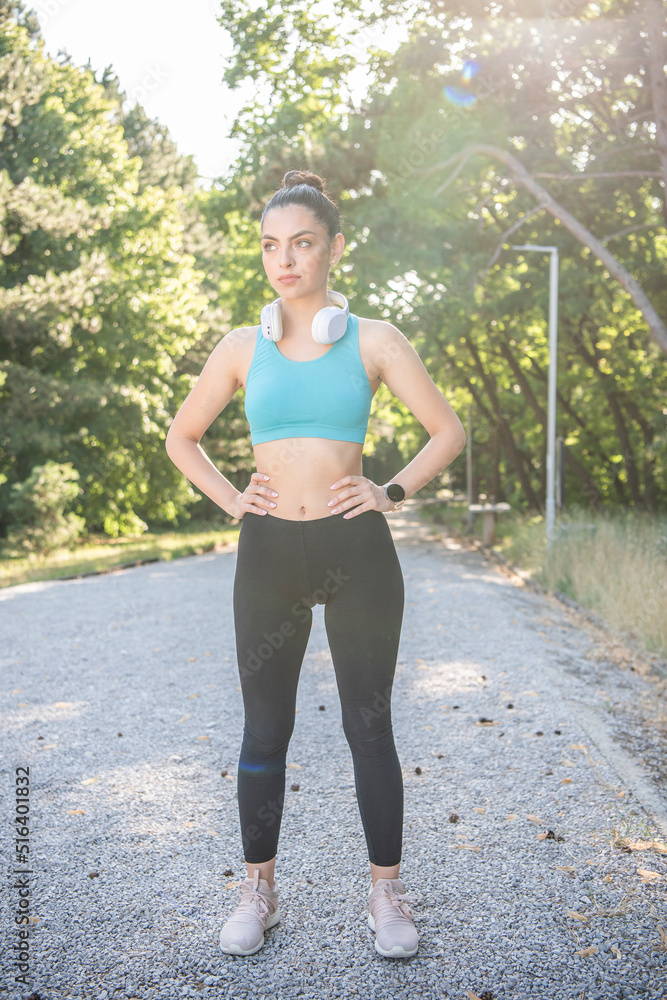 A beautiful young girl is jogging in the park. Healthy way of living. A beautiful young girl is jogging in the park. Healthy way of living.