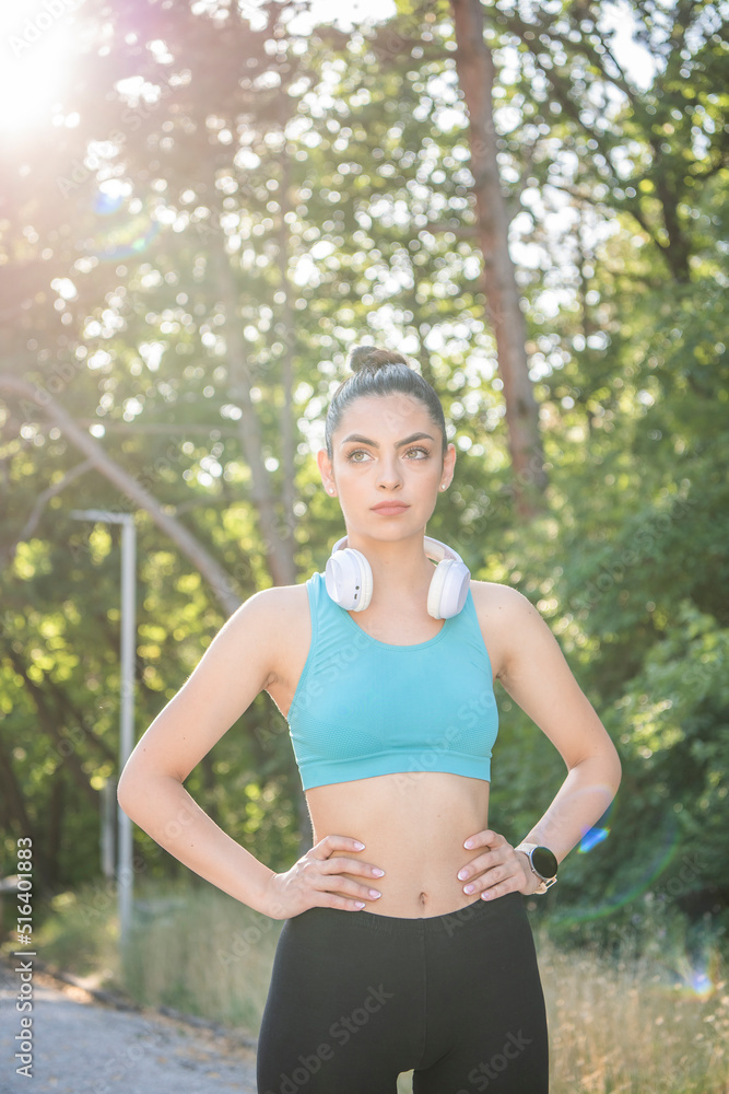 A beautiful young girl is jogging in the park. Healthy way of living. A beautiful young girl is jogging in the park. Healthy way of living.