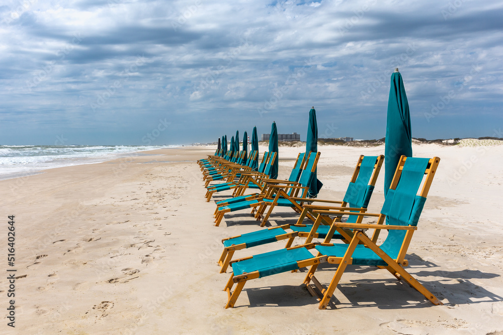 Empty Beach Chairs and Umbrellas Empty Beach Chairs and Umbrellas
