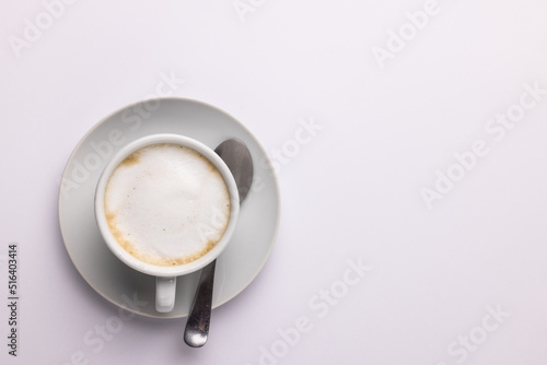 Image of white cup of coffee with milk on white background