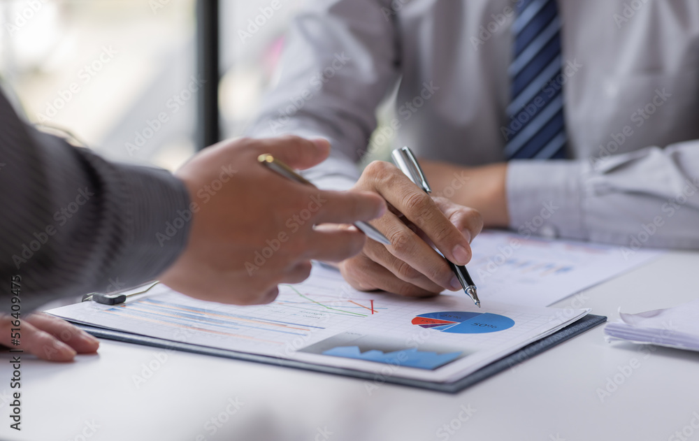 Fototapeta premium Close up of Team businesswoman Accounting using calculating income-expenditure and analyzing real estate investment data report Financial and tax systems concept. 