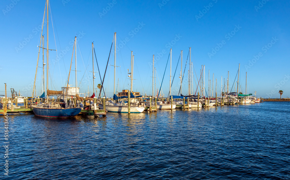 Sailboats in harbor in the evening. Rockport Texas