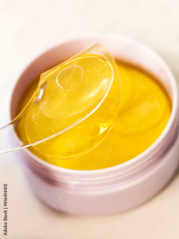 Golden eye patches with gel, facial care on a white background Golden eye patches with gel, facial care on a white background