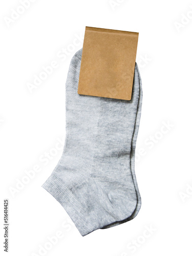 New grey socks with a label isolated on white background