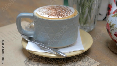 A close-up on a cup of cream coffee