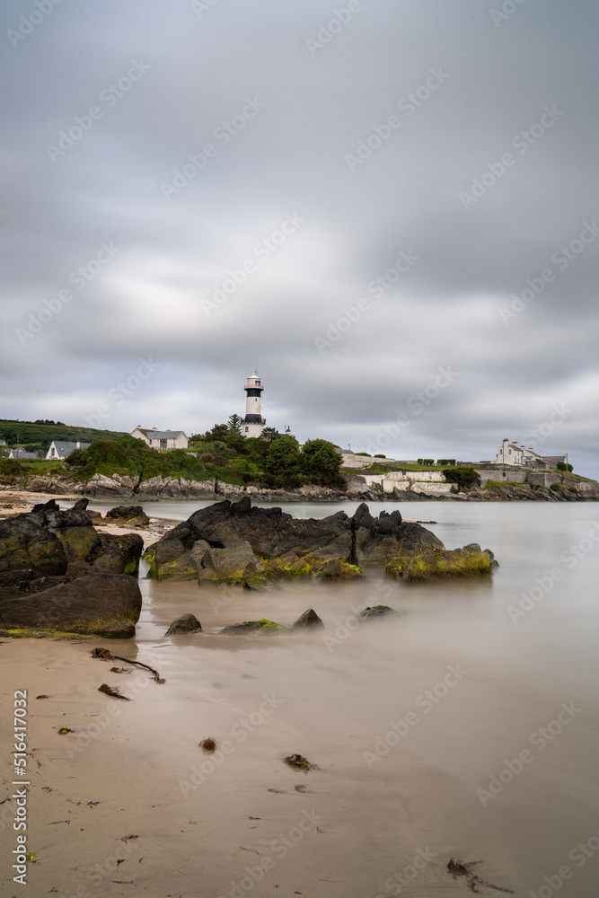 vertical view of the historic Stroove Lighthouse and beach on the Inishowen Peninsula on Ireland's Wild Atlantic Way scenic drive