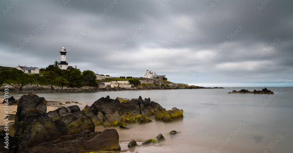 view of the historic Stroove Lighthouse and beach on the Inishowen Peninsula on Ireland's Wild Atlantic Way scenic drive