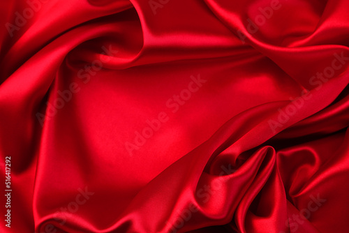 Closeup of rippled red silk fabric 