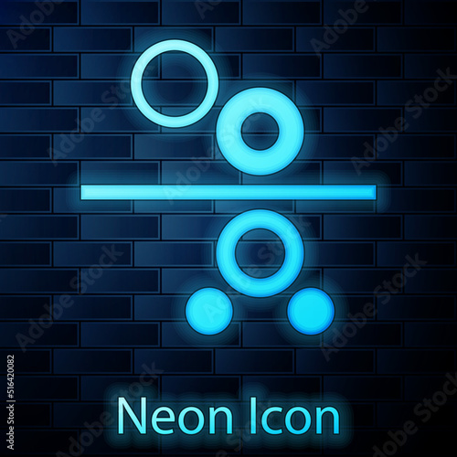 Glowing neon Paper roll of a printing press icon isolated on brick wall background. Vector