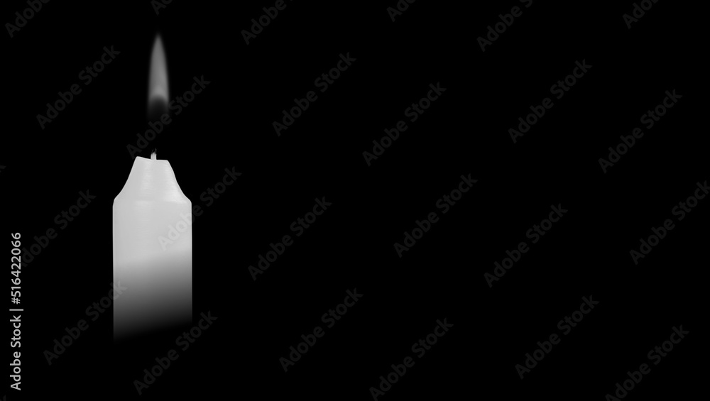Candle burning in the black background. The concept of mourn, grief or mourning Candle burning in the black background. The concept of mourn, grief or mourning
