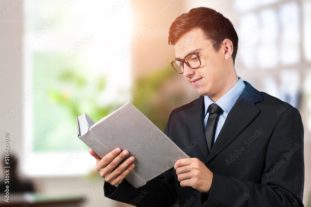 Smart student writing education essay story in notepad, learning and studying in coworking space Smart student writing education essay story in notepad, learning and studying in coworking space