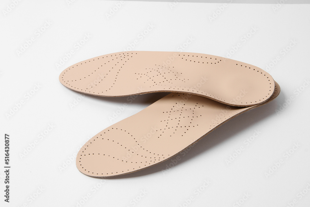 Insoles isolated on a white background. Medical orthopedic insoles. Foot care. Insole cutaway layers. Treatment and prevention of flat feet and foot diseases. Inner soles of shoes Insoles isolated on a white background. Medical orthopedic insoles. Foot care. Insole cutaway layers. Treatment and prevention of flat feet and foot diseases. Inner soles of shoes