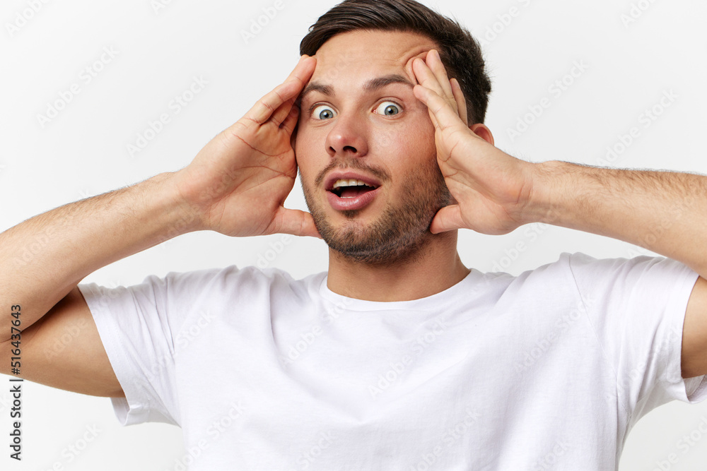 Shocked excited confused tanned handsome man in basic t-shirt touch head open mouth posing isolated on over white studio background. Copy space Banner Mockup. People emotions Lifestyle concept Shocked excited confused tanned handsome man in basic t-shirt touch head open mouth posing isolated on over white studio background. Copy space Banner Mockup. People emotions Lifestyle concept