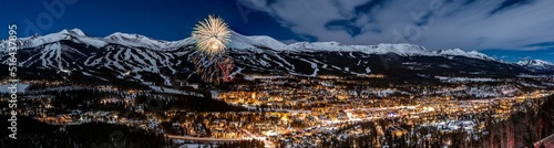 Panoramic view of New Year's Eve fireworks against snowy mountains in Breckenridge, Colorado photo